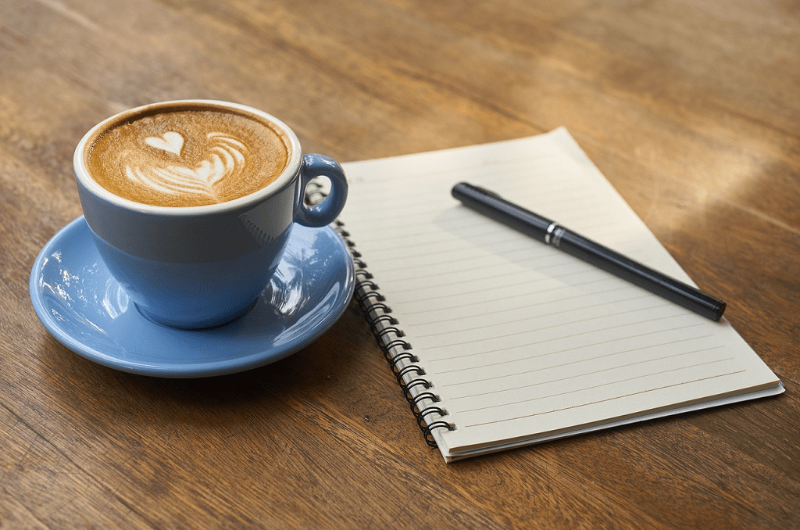 note and coffee
