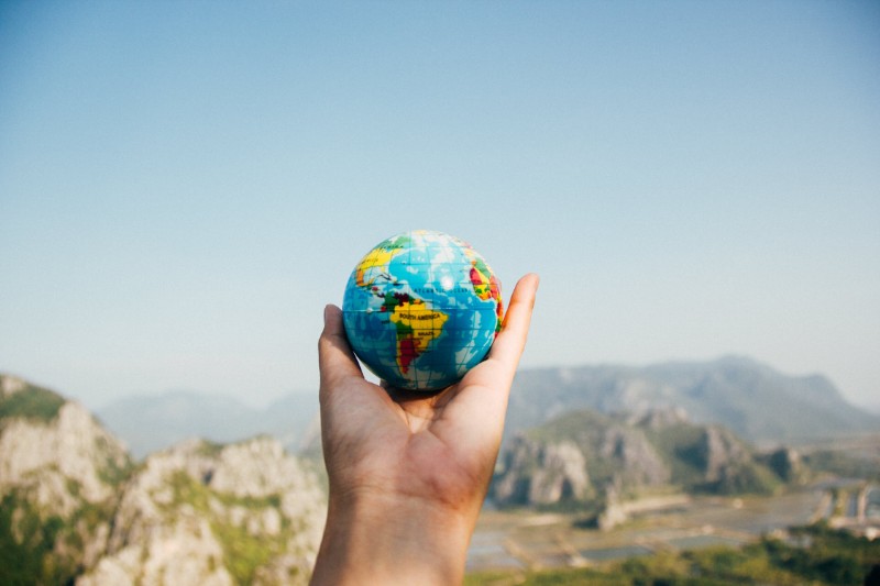 lifting globe in hand