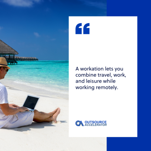 a man infront of the laptop working in the beach