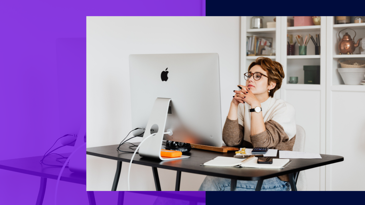 Focused female employee reading information on computer in office