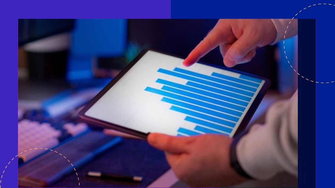 Hand interacting with bar graph on tablet, driving business intelligence through outsourced data scientists.