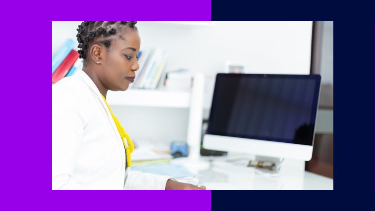 African virtual assistant working at computer, exploring offshore hiring.