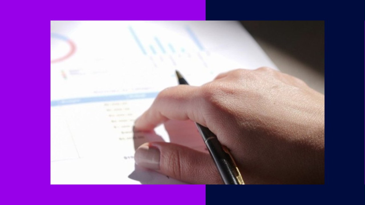 Hand with pen analyzing growth charts, enabling PE firms to scale research without in-house hires.