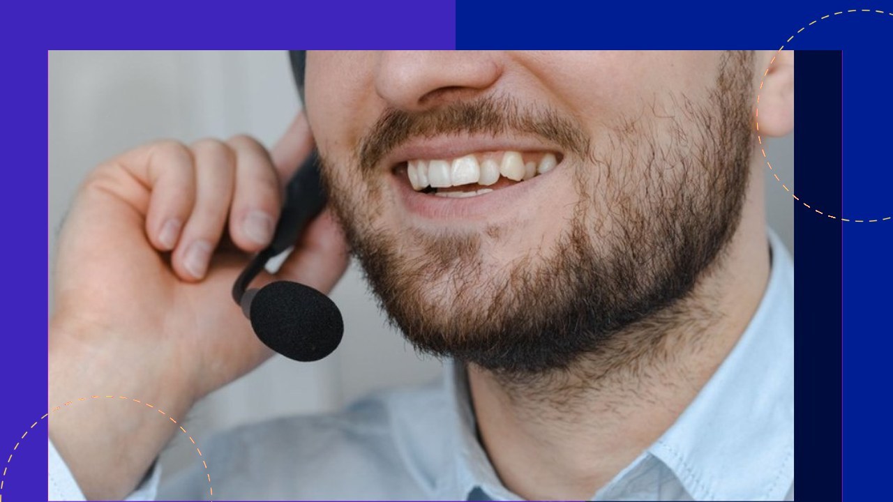 Man with headset smiling, enhancing customer service through strategic outsourcing.