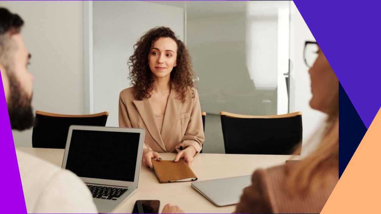 Woman in blazer interviews candidates, highlighting direct hiring risks for global business.