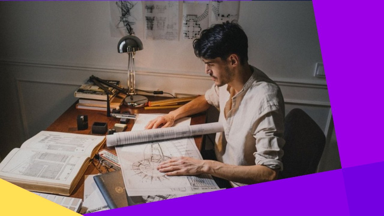 Architect reviews plans at desk, growing firm without burnout.