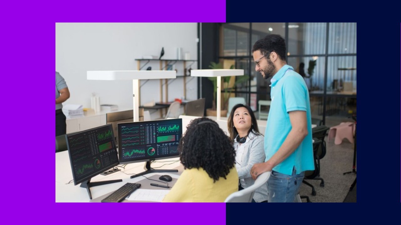 Team collaborating around monitors displaying data, human-in-the-loop annotation outperforming AI.
