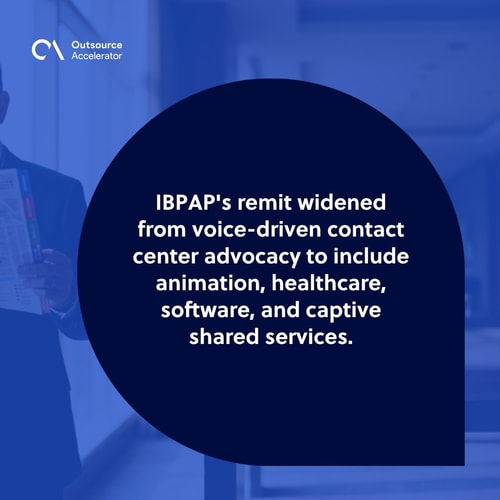 Senior IBPAP sub-association lead at the far left of a Manila industry conference lounge holding an IBPAP sector map with animation, healthcare, software, and captive shared services tabs