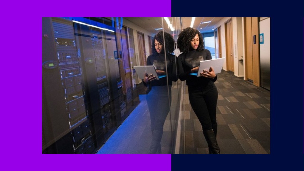 Two women with laptops near server racks, reflecting outsourcing shifts redefining global operations.