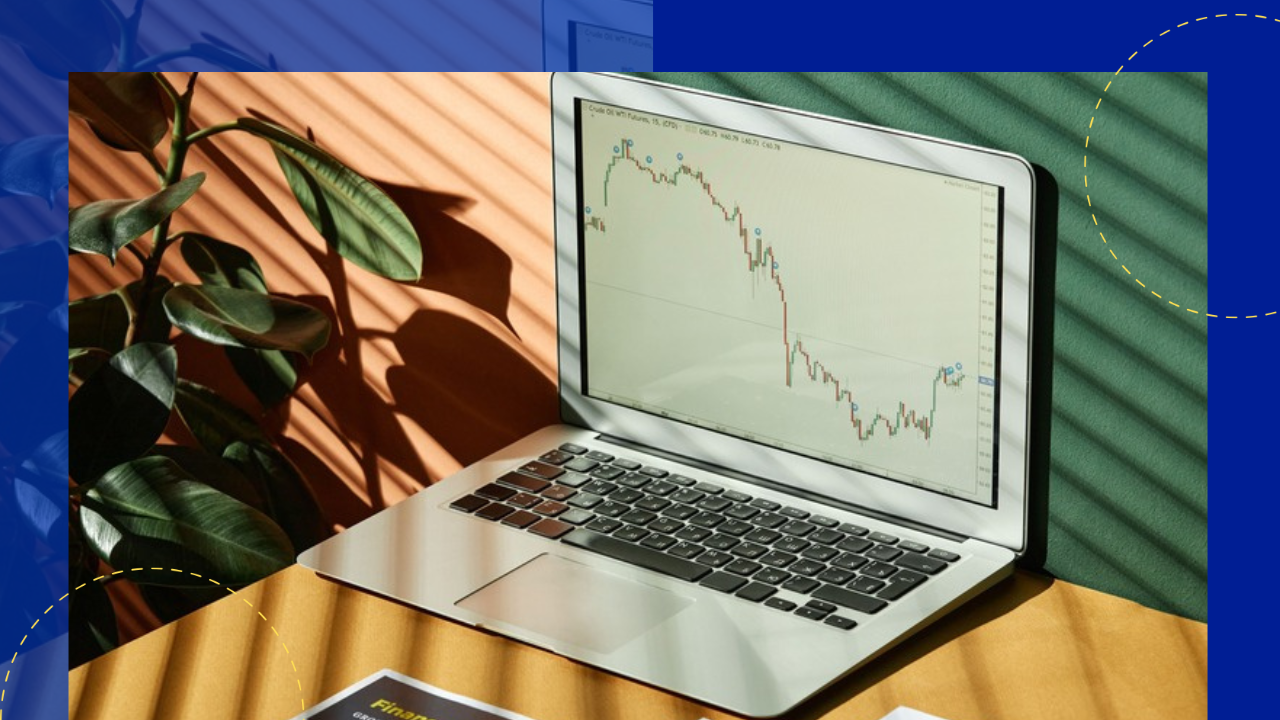 Laptop displaying a rising financial graph in a sunlit workspace — where the outsourcing dollar went