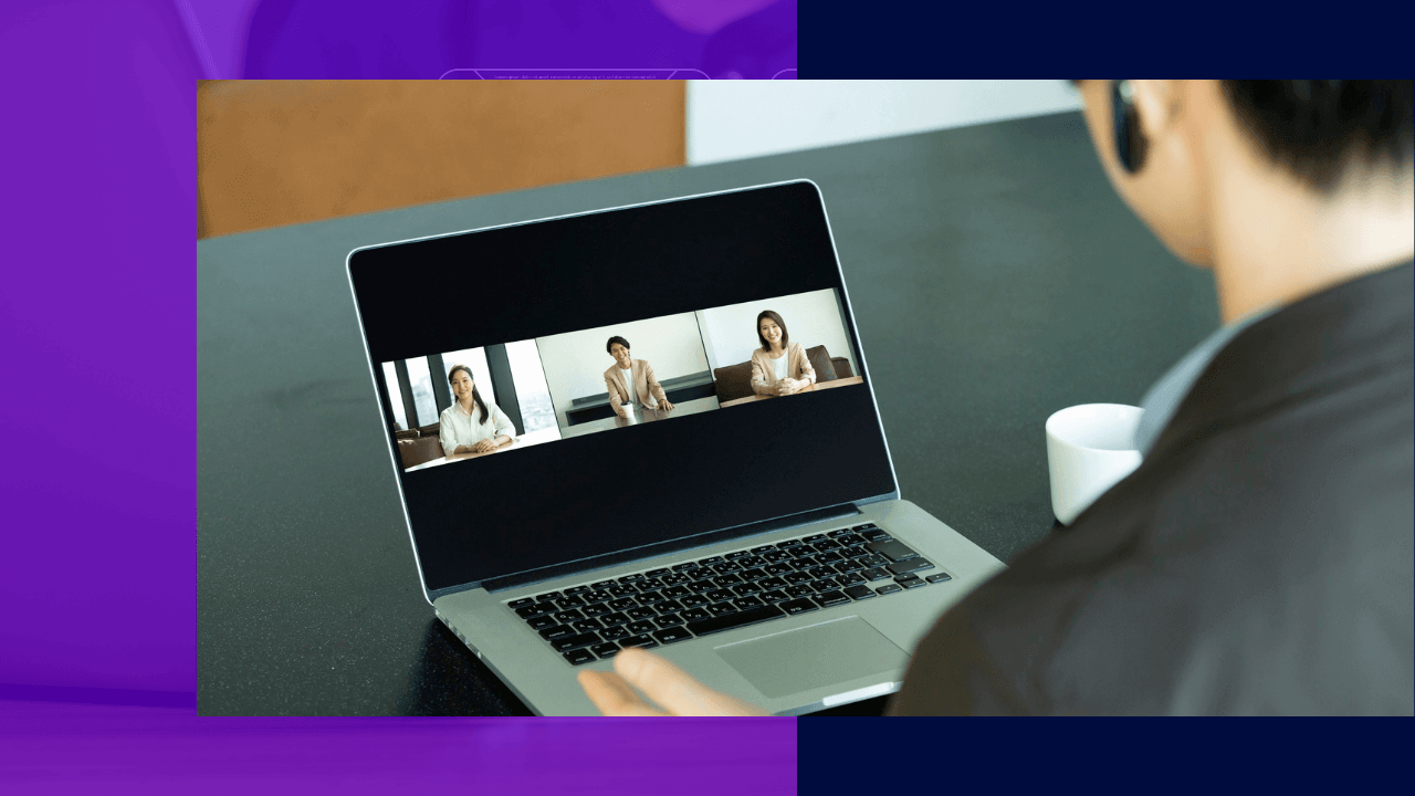 Man on a laptop video call showing three colleagues on screen with a coffee cup beside him, purple and navy accent panels around the photo.