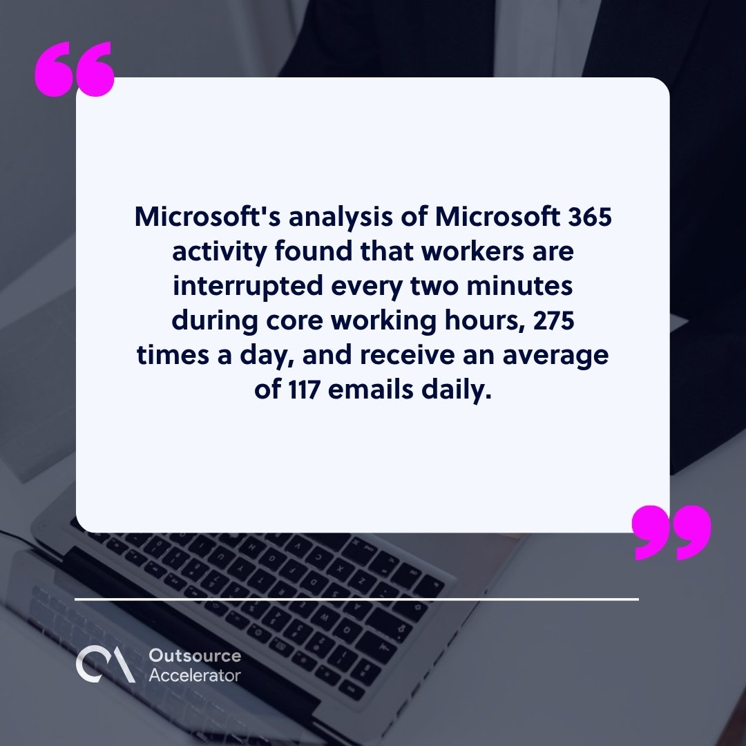 AI executive assistant - hands on a laptop with a phone nearby