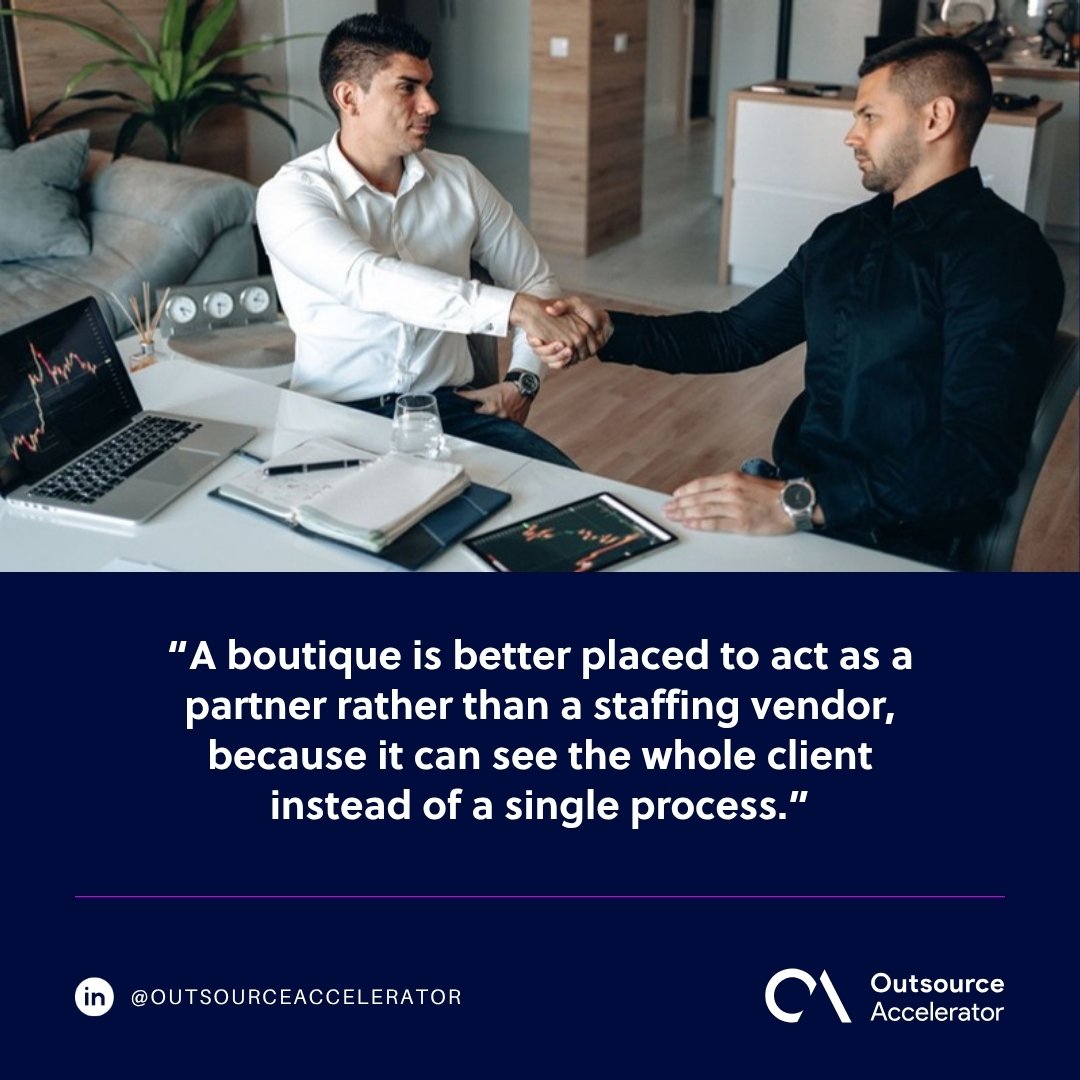 boutique BPO - two business partners shaking hands across a desk