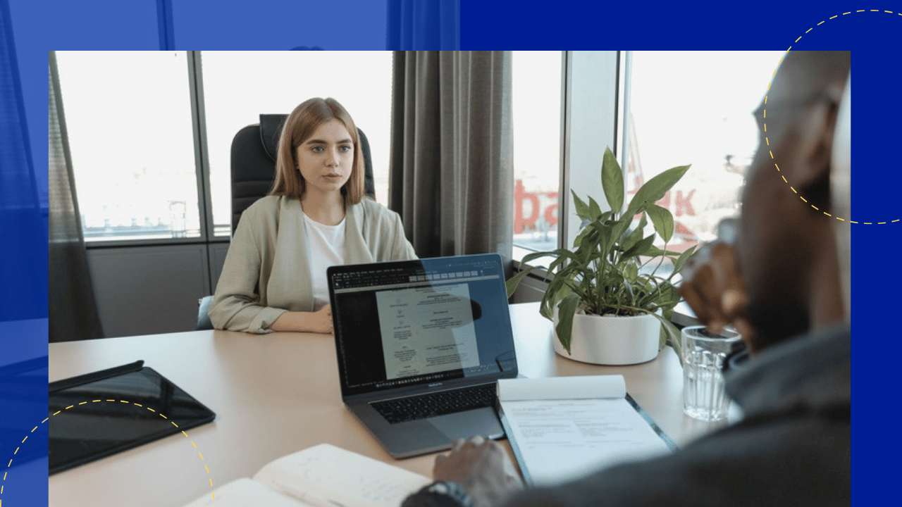 offshore hiring - job interview across an office desk with a laptop