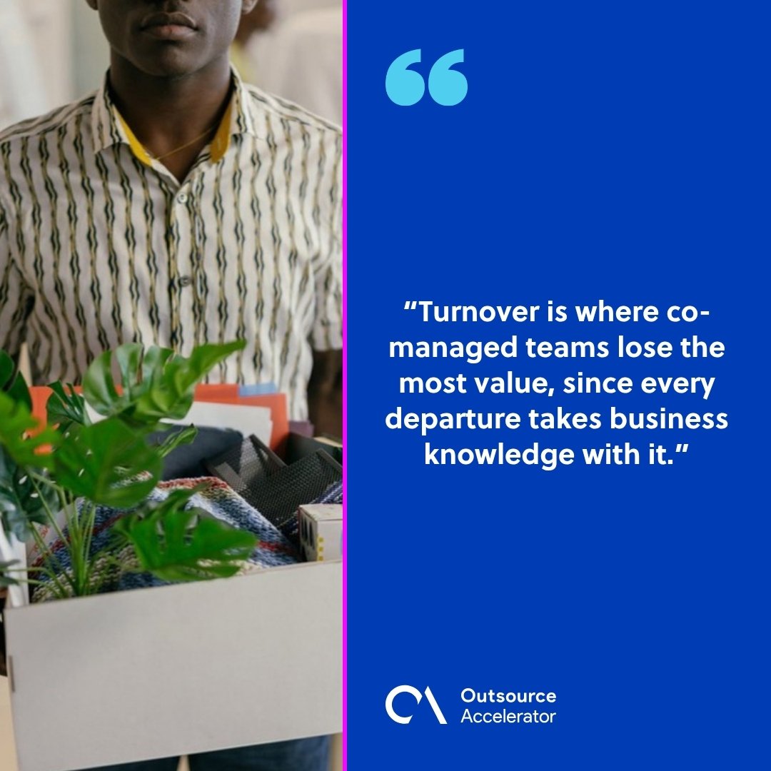 Co-management - a departing employee carrying a box of desk belongings