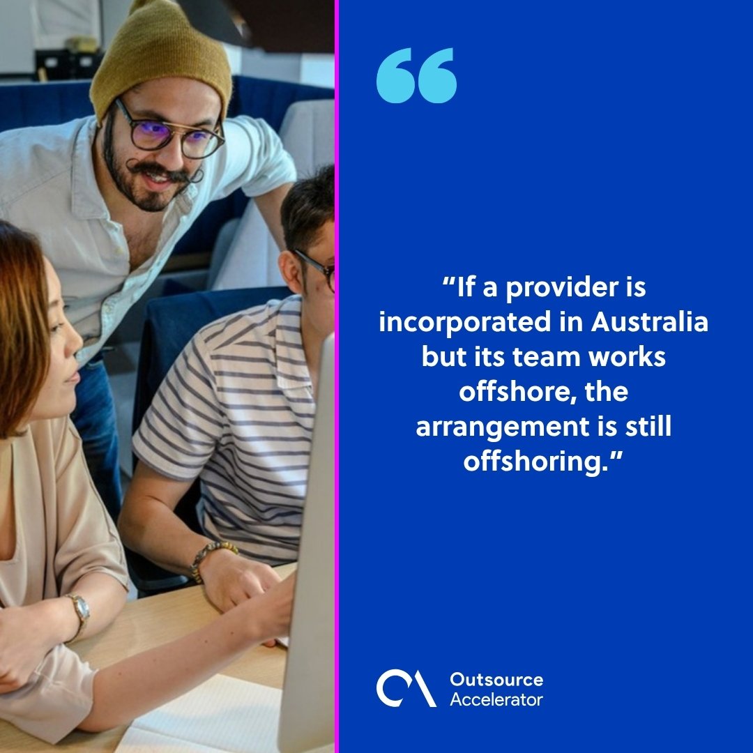 CPS 230 offshore teams - coworkers collaborating around a laptop in an office