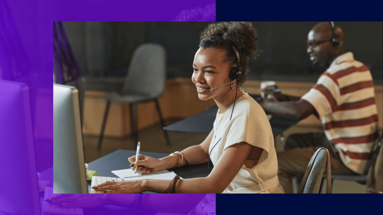 virtual receptionist services - agent with a headset taking notes at a desk