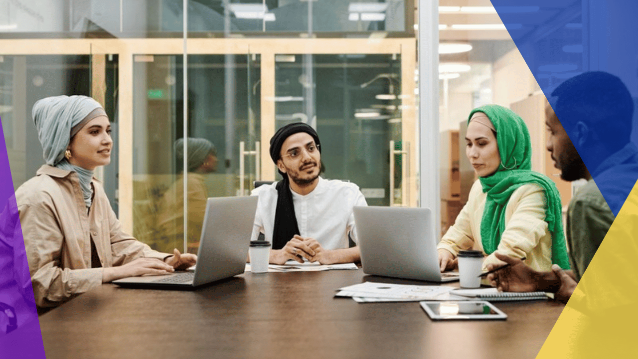 permanent establishment risk overseas hiring - diverse team meeting around a table with laptops