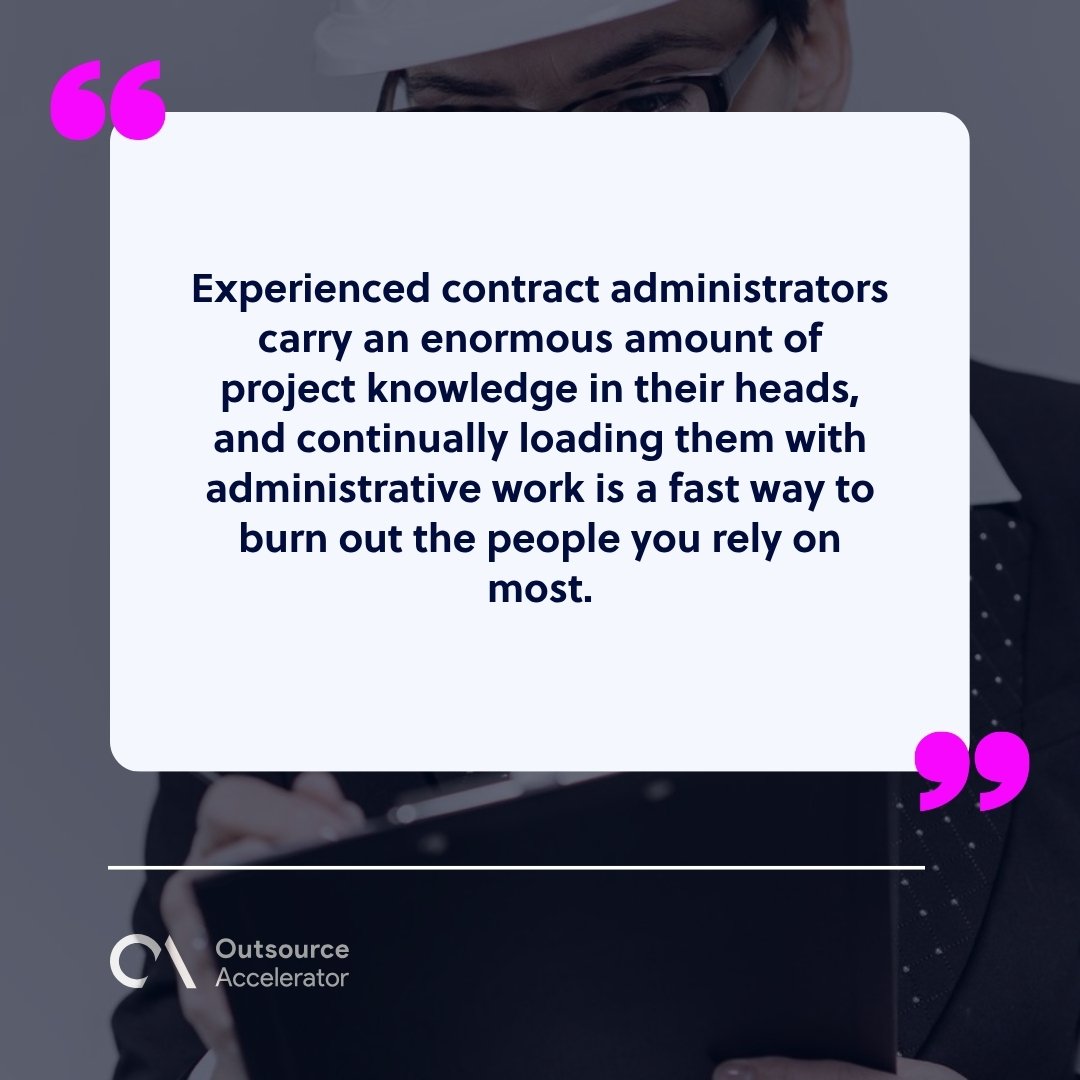 construction contract administration - an engineer in a hard hat reviewing paperwork on a clipboard