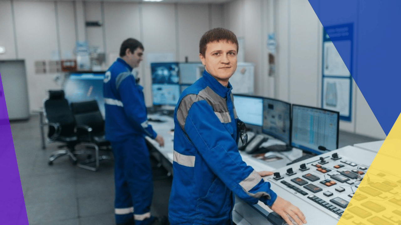 OT IT convergence staffing - two technicians operating a plant control panel