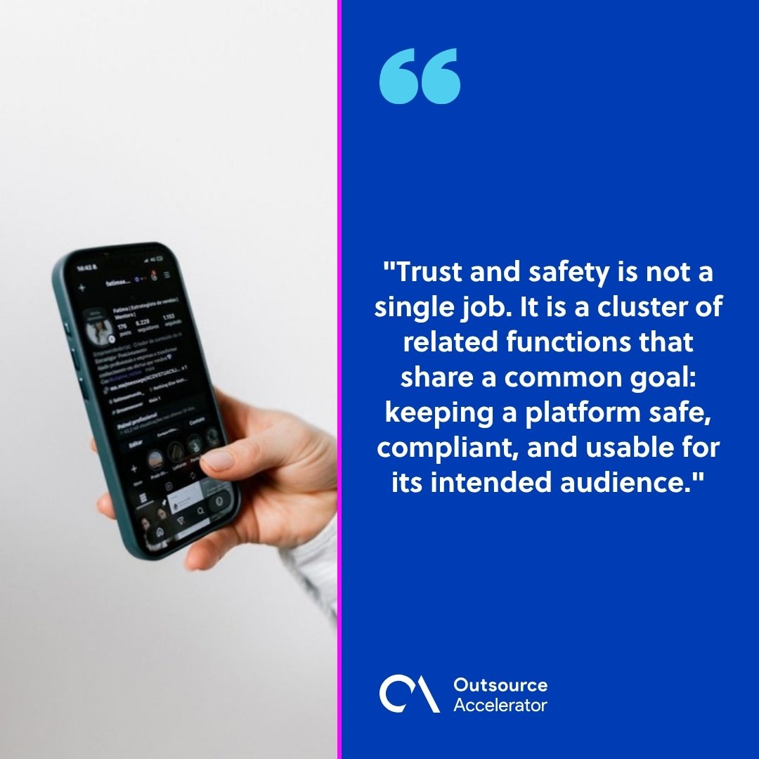 trust and safety operations outsourcing - hand holding a smartphone showing a social media app