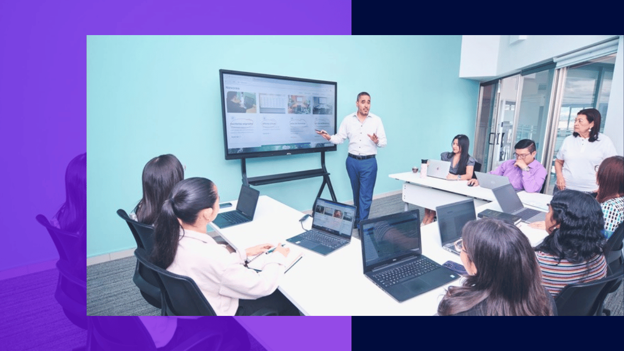 why agents quit in the first 90 days - a trainer presenting to new hires at laptops in a meeting room